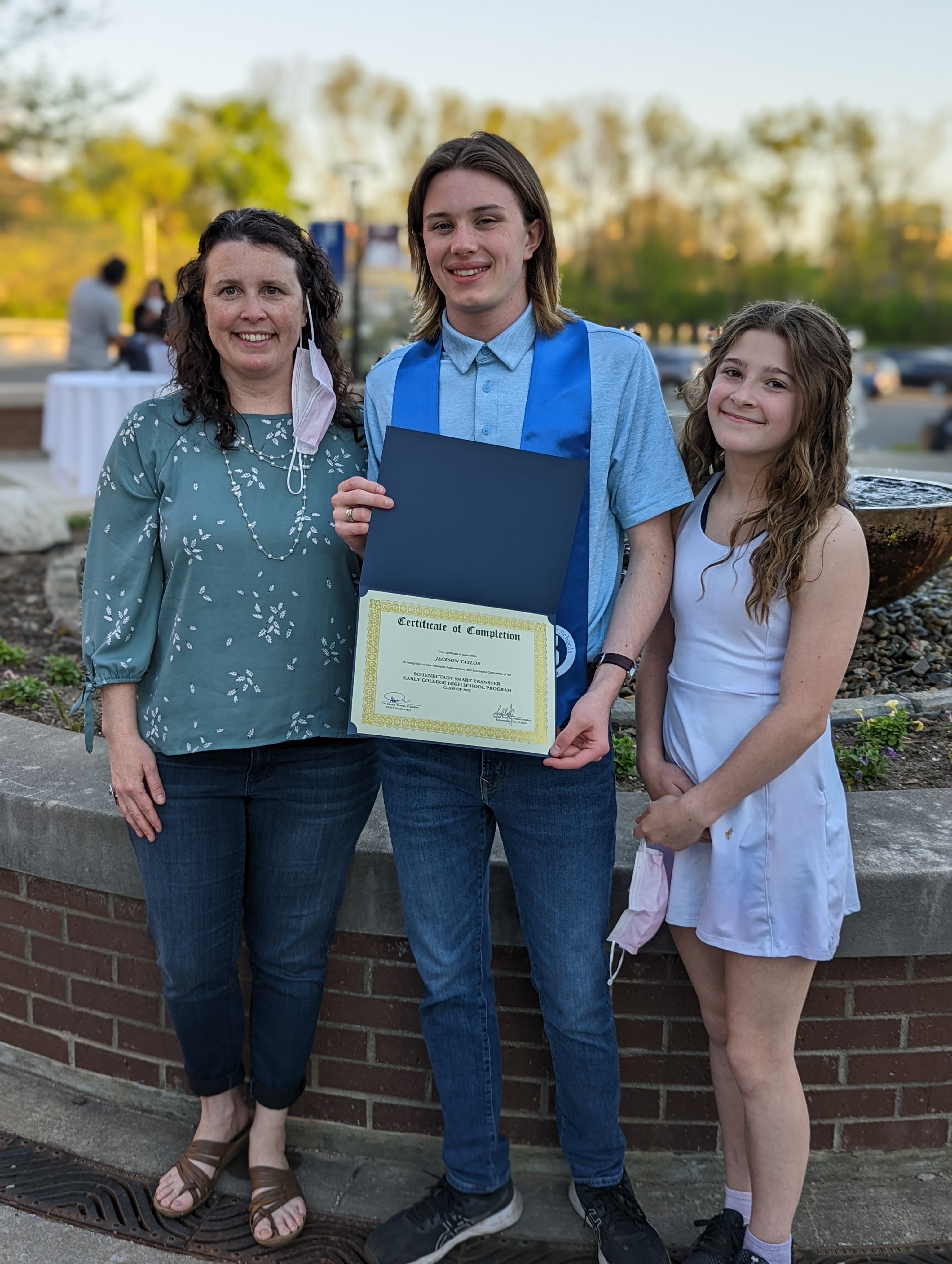 Jackson Taylor and family standing outside 