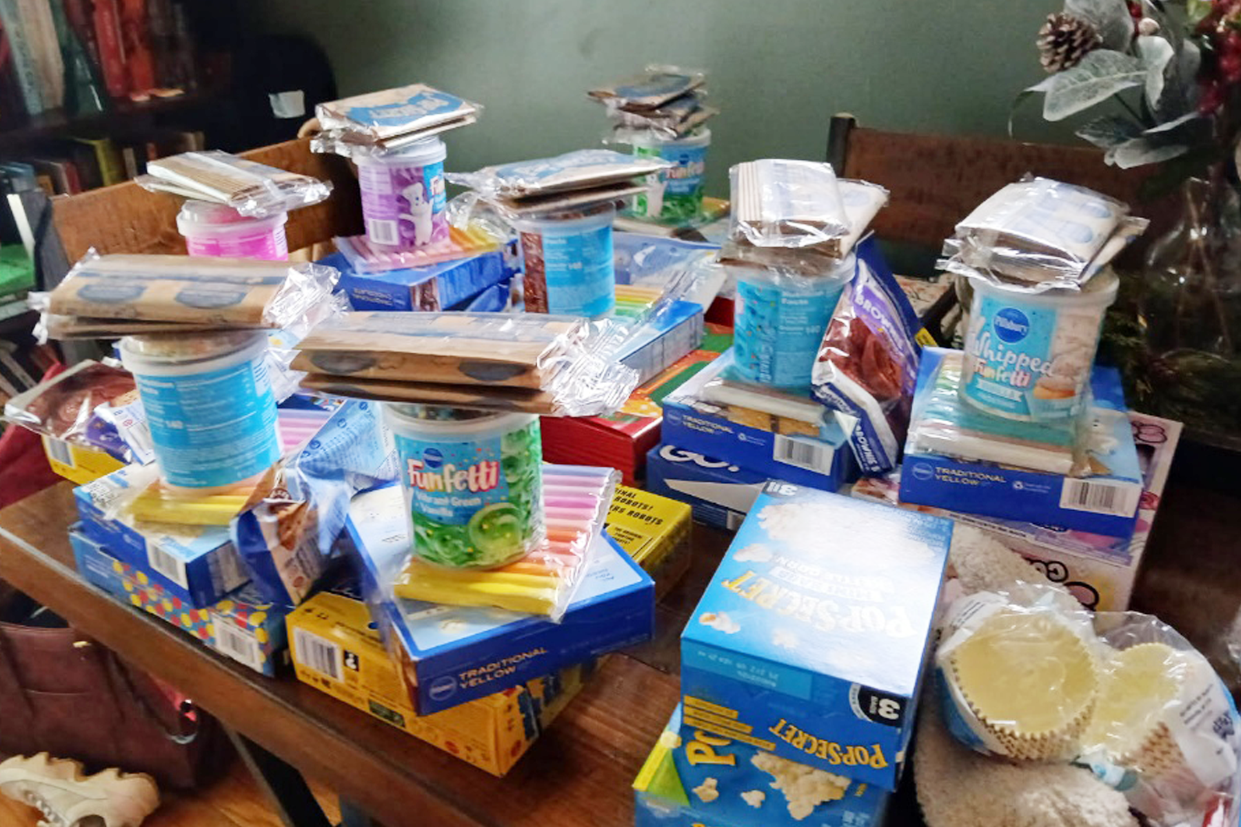 Items that are being donated stacked on a table