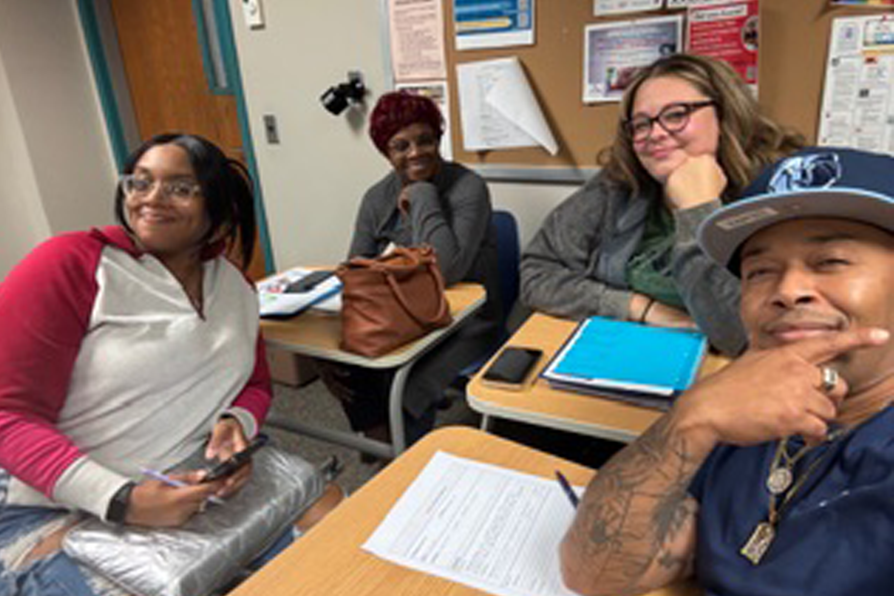 Student sitting at table in classroom