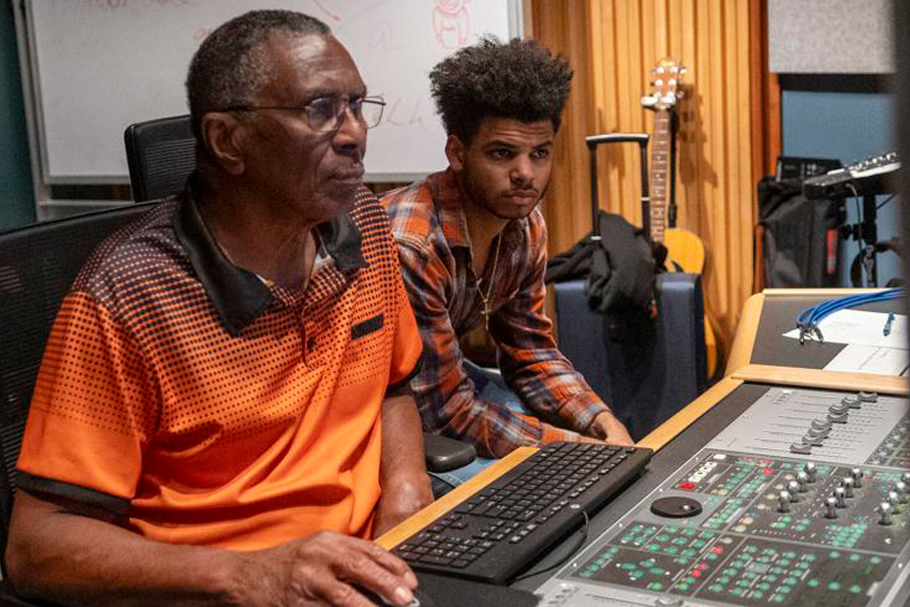 Engineer Errol Brown sitting at console, recording