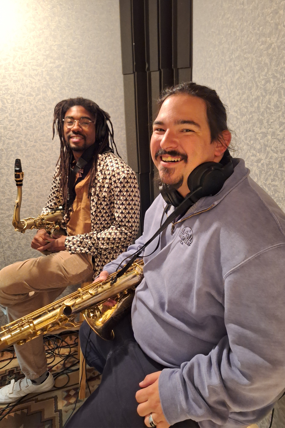 Saxophonists for Steel Pulse in studio, smiling