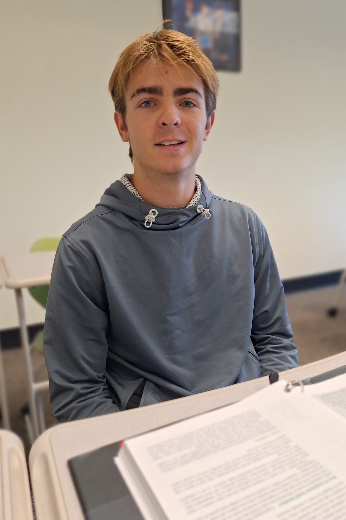 Taylor Lang sitting in class, smiling