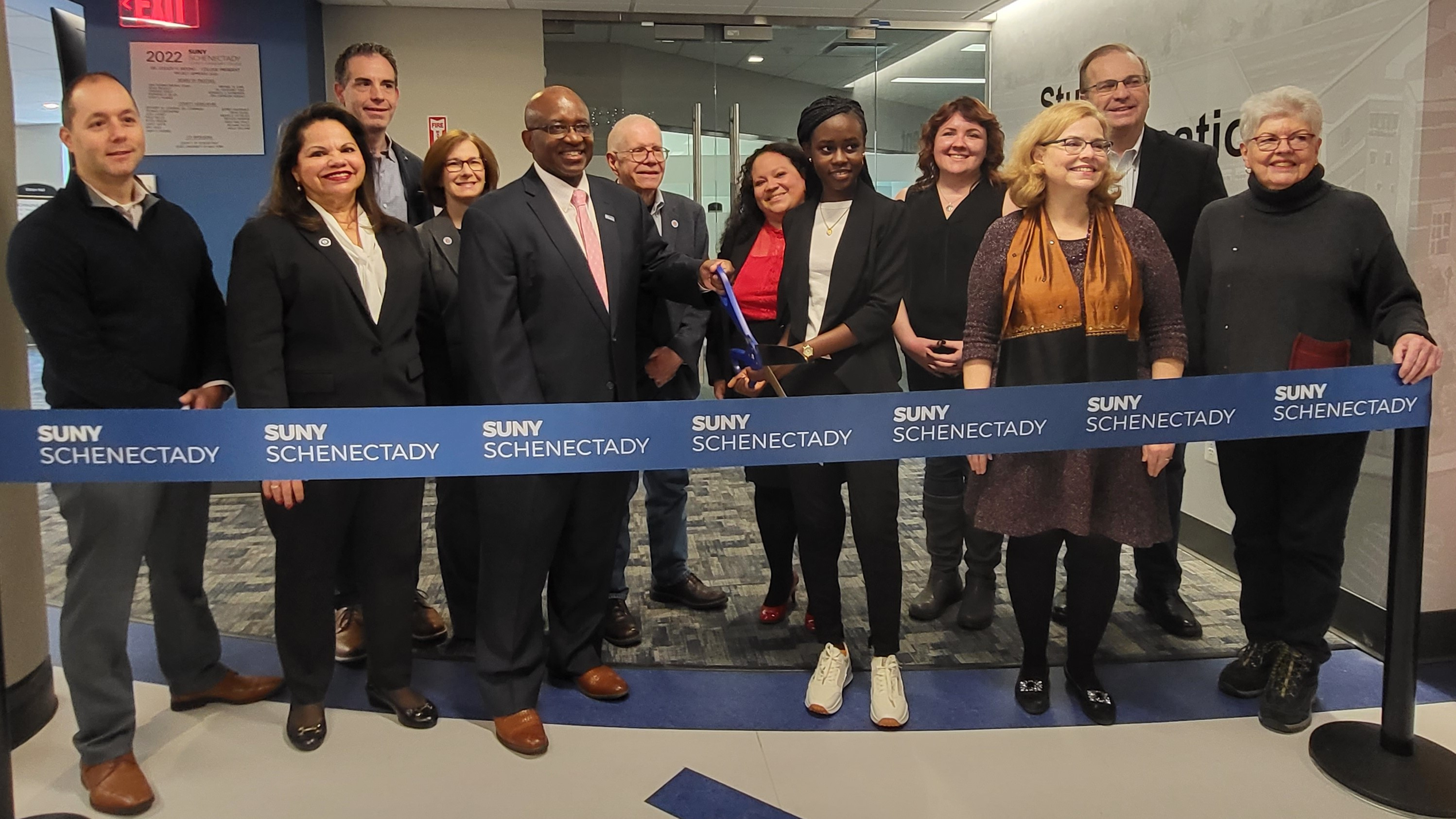 College officials and supporters cutting the ribbon for the new Welcome Center, Elston Hall