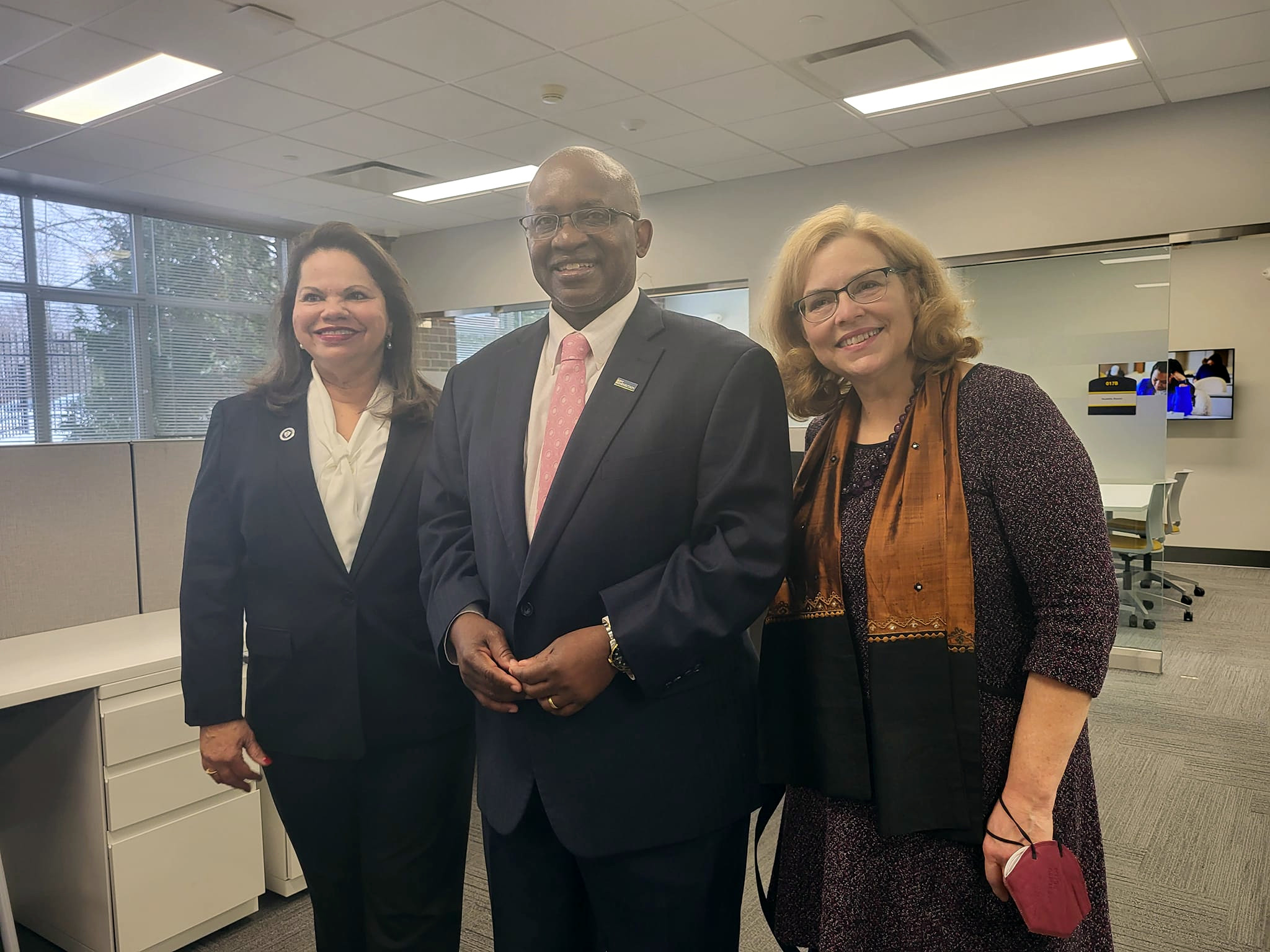 Dr. Steady Moono, Johanna Duncan-Poitier, Ann Fleming Brown standing in new Welcome Center