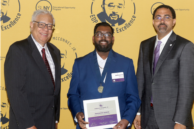 Hemnarine Gobind with SUNY officials on stage, accepting EOP Award