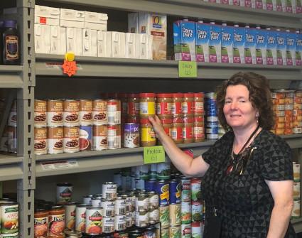 Robyn King in College's Food Pantry. 