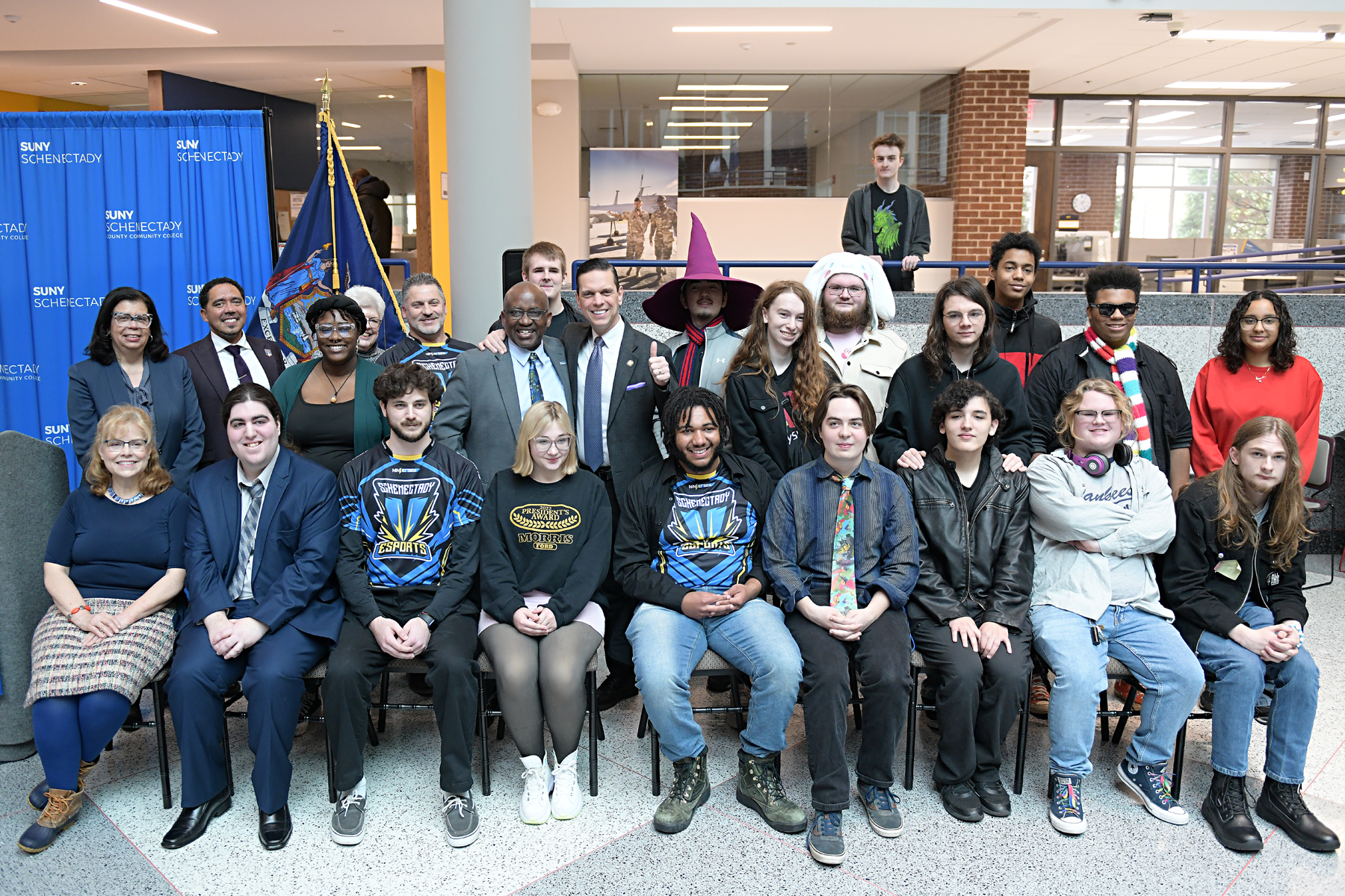 Groupd of students and college administrators seated during Grand Opening of new eSports Arena