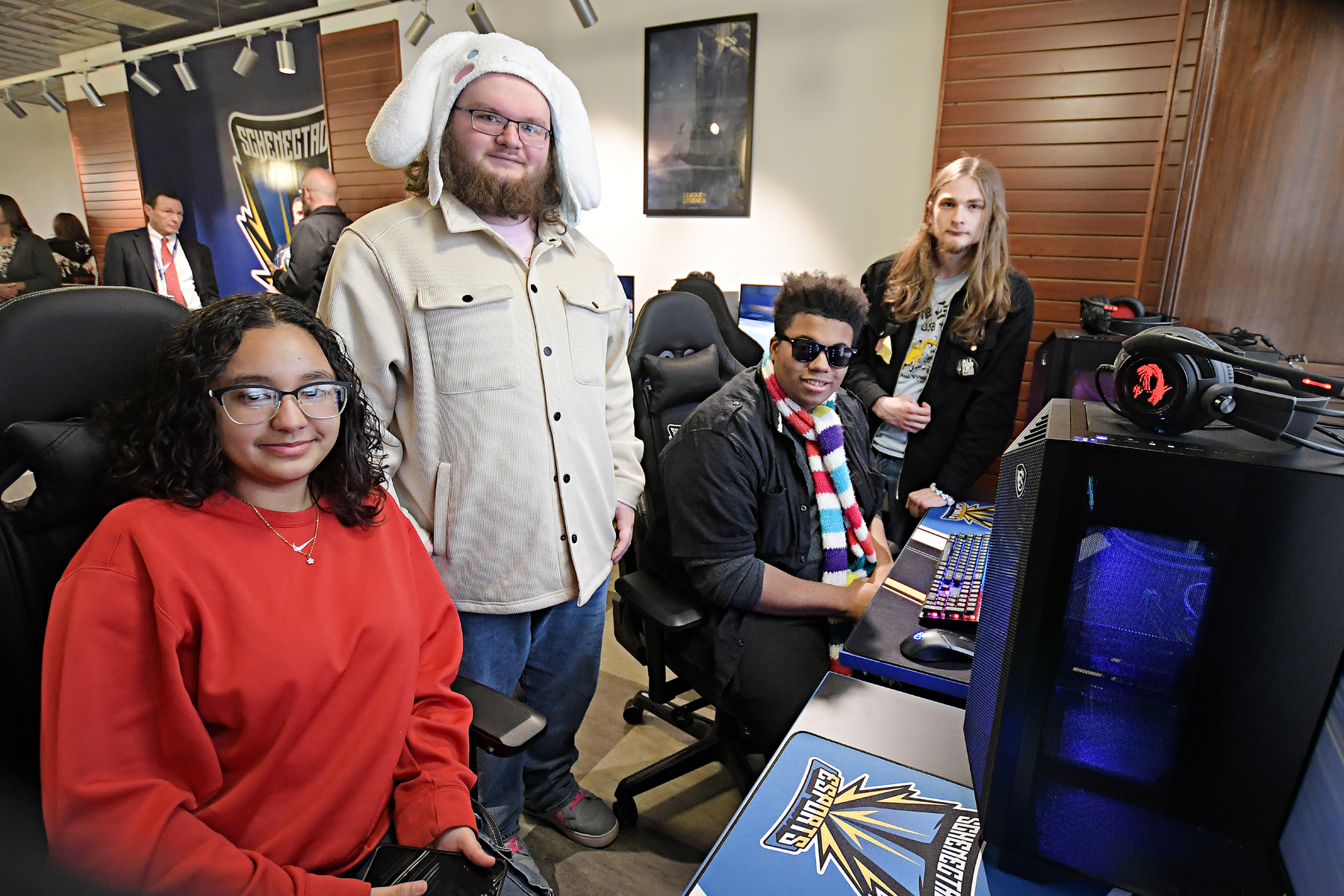 Four students seated at gaming console in new eSports Arena.