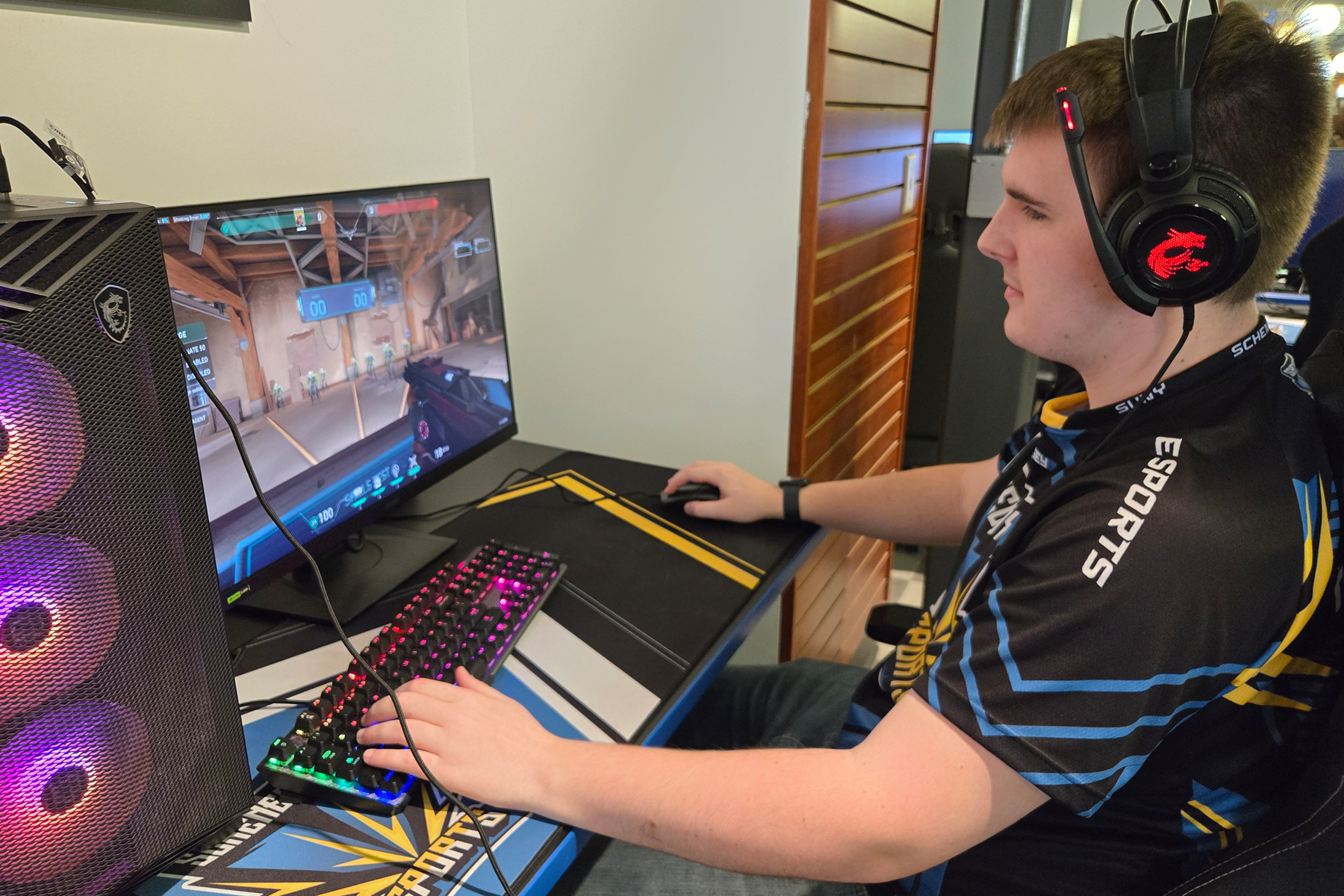 Aiden O'Rourke playing a game in the eSports Arena.