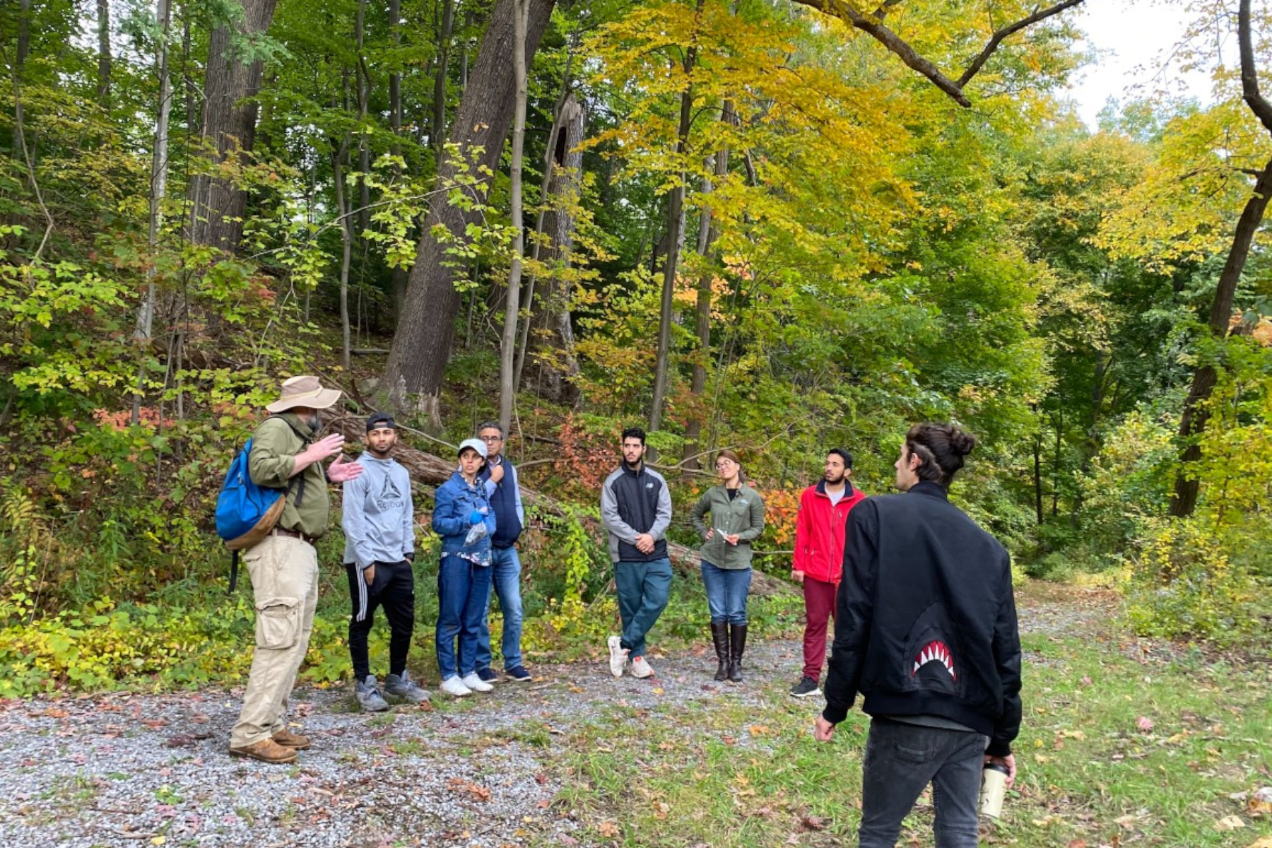 Science students and faculty standing in Vale Park near trees